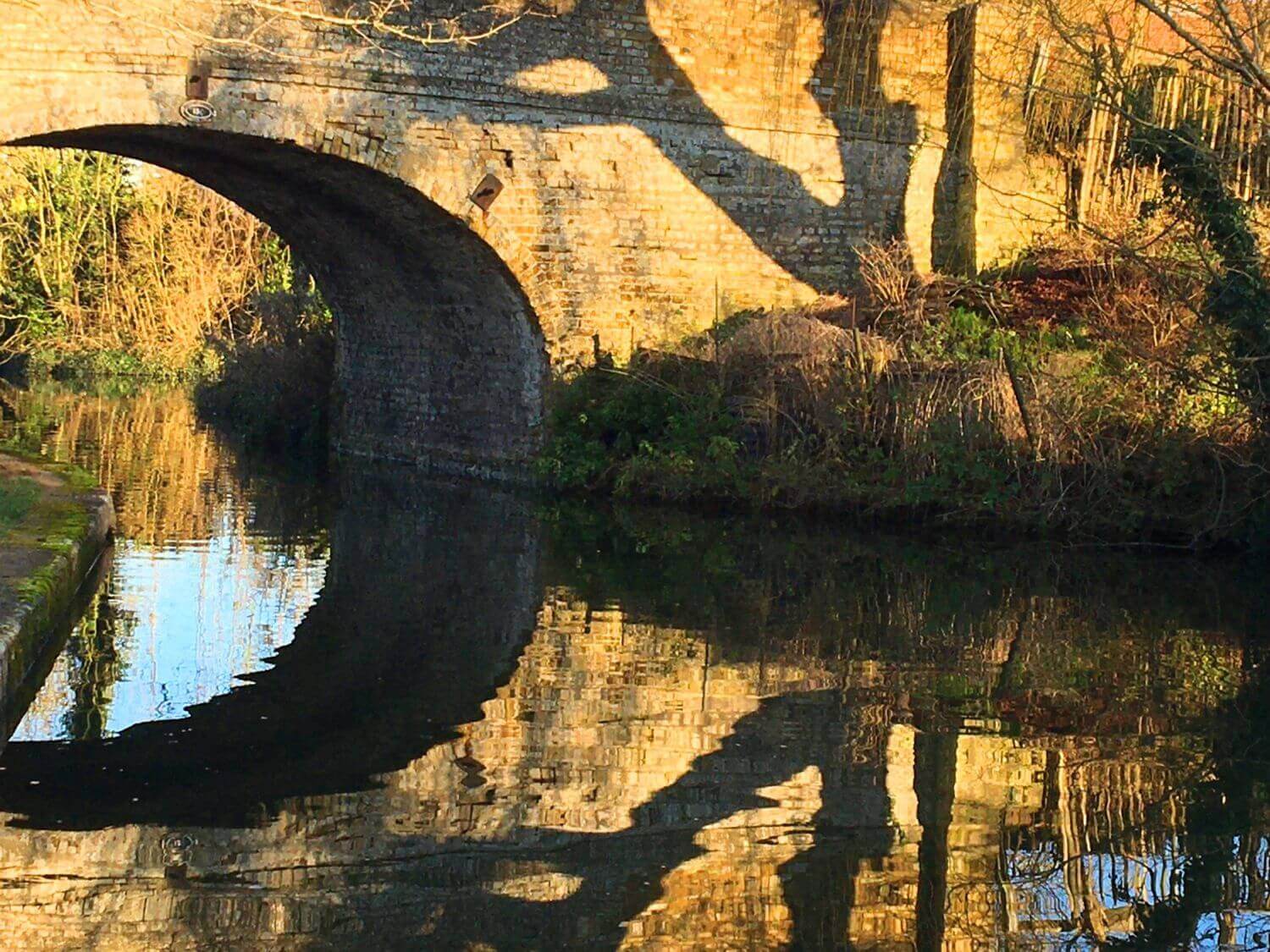 Close up of a bridge over a canal on a sunny day